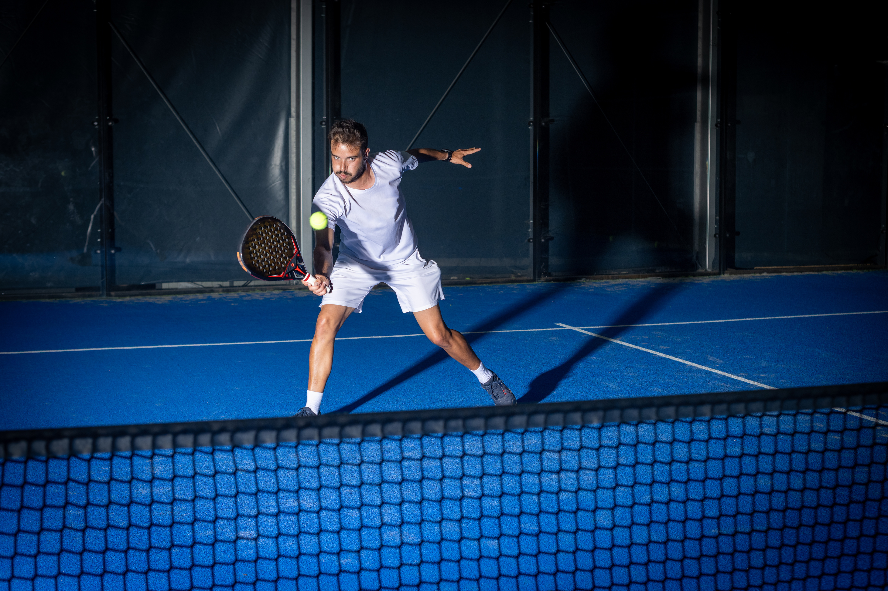 Man Playing Padel Tennis Indoor